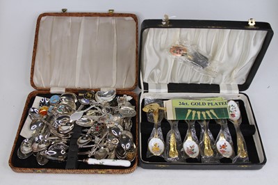 Lot 517 - A collection of mixed souvenir spoons,...