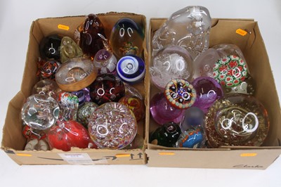 Lot 554 - Two boxes of glass paperweights, to include...