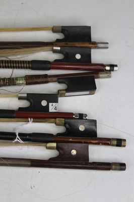 Lot 550 - A collection of six vintage full size violin bows