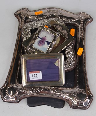 Lot 552 - A silver clad easel photograph frame,...