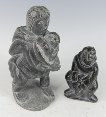 Lot 659 - Eskimo Art - a carved grey stone figure group...