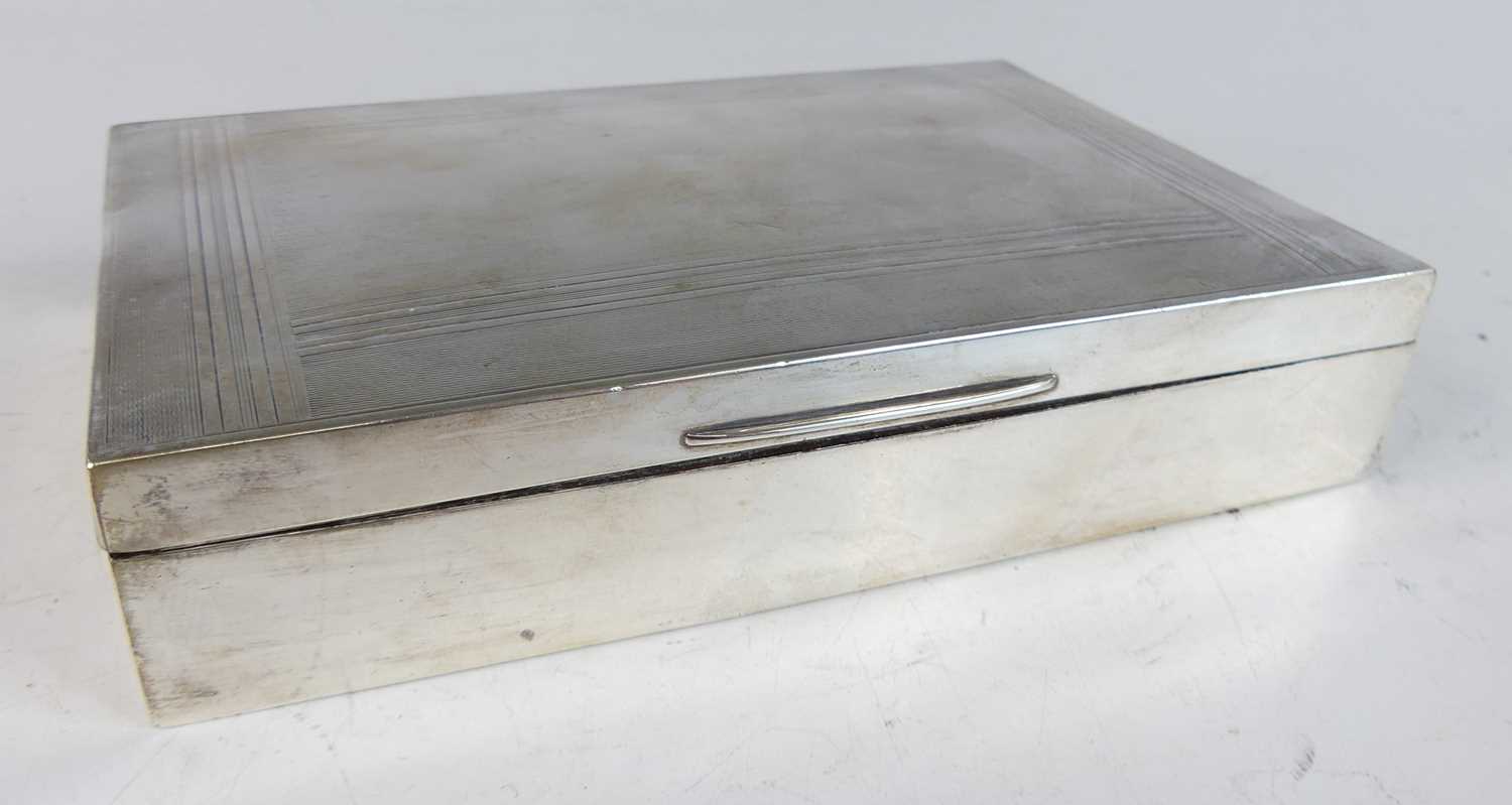 Lot 561 - A late Art Deco silver table cigarette box,...