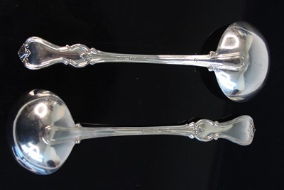 Lot 2102 - A pair of Victorian silver soup ladles, in the...