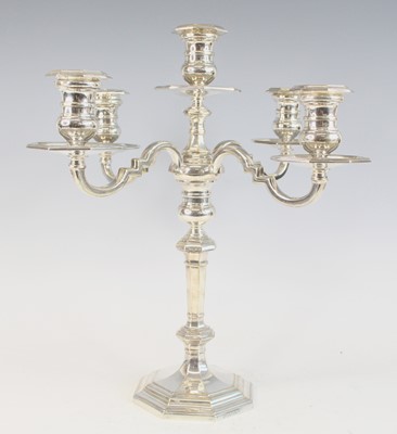 Lot 2144 - An Elizabeth II silver four-branch candelabra,...