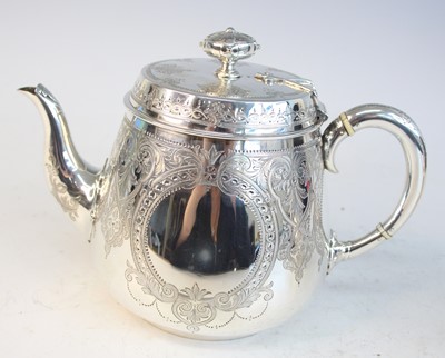 Lot 2092 - A Victorian silver teapot and matching cream,...