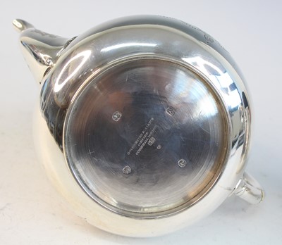 Lot 2092 - A Victorian silver teapot and matching cream,...