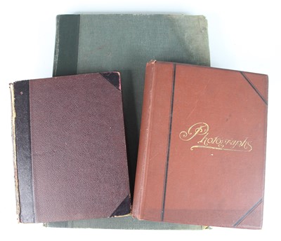 Lot 641 - A late Victorian photograph album, bound in...