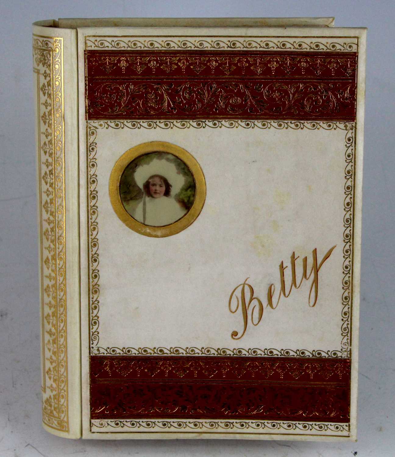 Lot 99 - An Edwardian photograph album, bound in gilt...