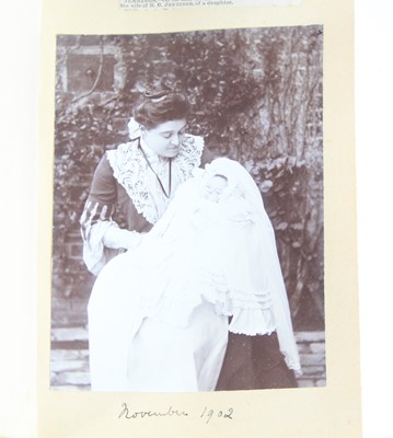 Lot 99 - An Edwardian photograph album, bound in gilt...