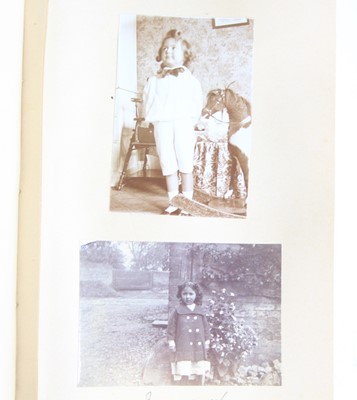 Lot 99 - An Edwardian photograph album, bound in gilt...