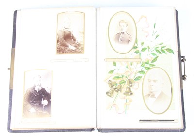 Lot 99 - An Edwardian photograph album, bound in gilt...