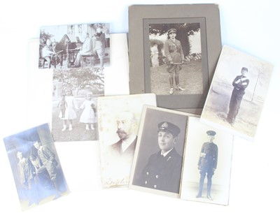 Lot 99 - An Edwardian photograph album, bound in gilt...