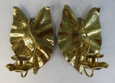 Lot 629 - A pair of Arts & Crafts brass wall sconces,...
