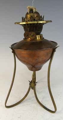 Lot 614 - W.A.S. Benson - a copper and brass oil lamp,...