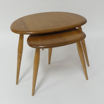 Lot 788 - A 1960s Ercol blond elm 'Pebble' nest of two...