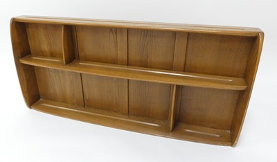 Lot 786 - An Ercol blond elm sectional wall...