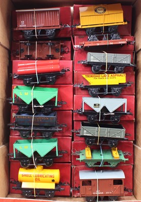 Lot 295 - Seventeen Hornby 4-wheel post-war goods wagons,...