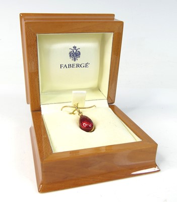 Lot 2200 - An 18ct yellow gold Fabergé egg pendant, with...