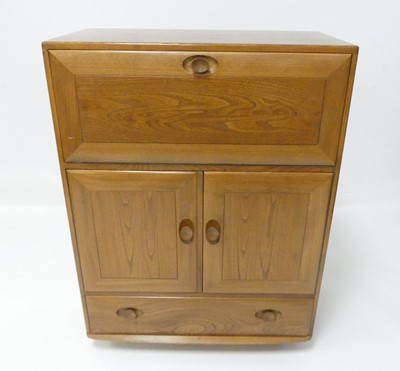 Lot 789 - An Ercol blond elm Windsor 469 portable drinks...