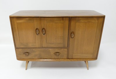 Lot 790 - A 1960s Ercol blond elm Windsor 366 compact...