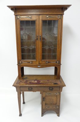 Lot 771 - An Arts & Crafts oak and copper mounted...