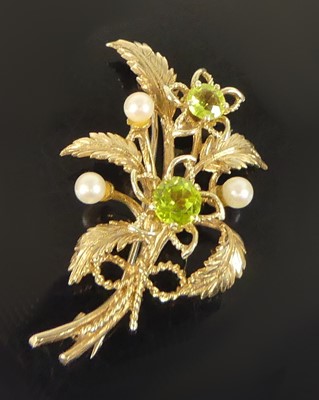 Lot 2158 - A 9ct yellow gold, peridot and pearl floral...