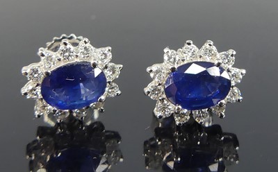 Lot 2197 - A pair of white metal sapphire and diamond...