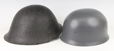 Lot 192 - A British Korean War steel turtle helmet,...