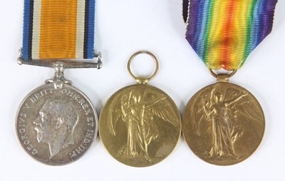 Lot 216 - A family group of three WW I medals to include...