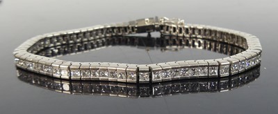 Lot 2243 - An 18ct white gold diamond articulated line...