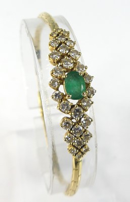 Lot 2217 - An 18ct yellow gold, emerald and diamond...