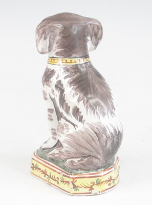 Lot 2030 - A Delft or Faience polychrome model of a dog,...