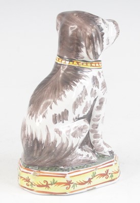 Lot 2030 - A Delft or Faience polychrome model of a dog,...