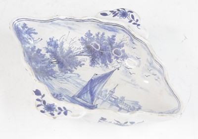 Lot 2029 - A Delft blue and white twin handled sauceboat,...
