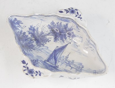 Lot 2029 - A Delft blue and white twin handled sauceboat,...