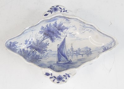 Lot 2029 - A Delft blue and white twin handled sauceboat,...