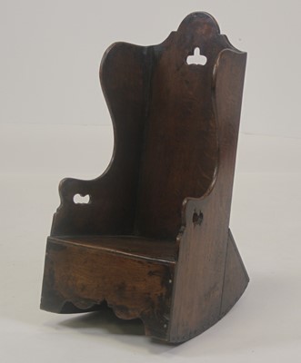 Lot 2521 - An antique oak child's lambing chair, the...