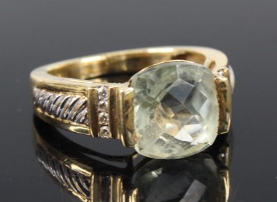 Lot 2183 - A yellow metal, green quartz and diamond dress...