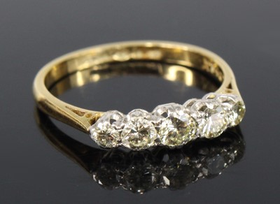 Lot 2176 - A yellow and white metal diamond half hoop...