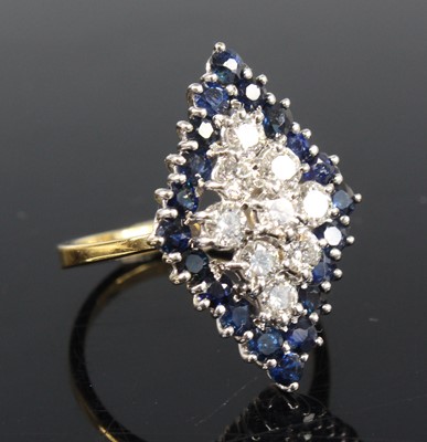 Lot 2205 - An 18ct yellow and white gold, sapphire and...