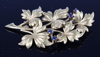 Lot 2187 - An 18ct yellow gold stylised leaf spray brooch,...