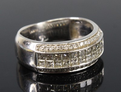 Lot 2206 - A white metal diamond four-row half hoop...