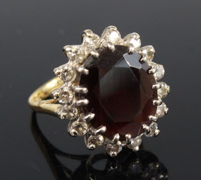 Lot 2175 - A yellow and white metal, garnet and diamond...