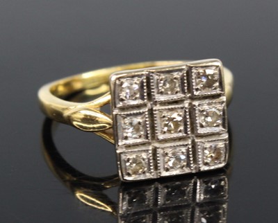 Lot 2155 - An 18ct yellow and white gold diamond...