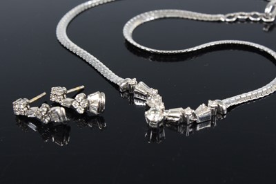 Lot 2222 - A white metal diamond necklet and earring...