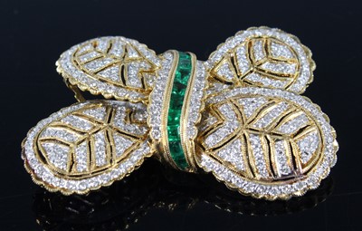 Lot 2188 - A yellow metal diamond and emerald stylised...