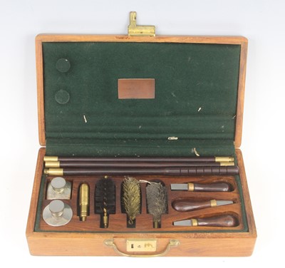 Lot 412 - A gun cleaning kit to include rods, brushes...