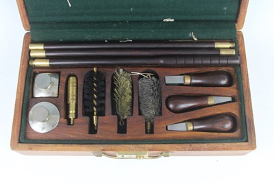Lot 412 - A gun cleaning kit to include rods, brushes...