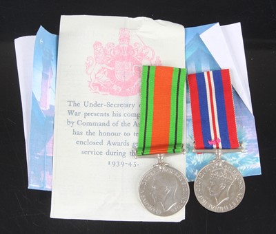 Lot 318 - A WW II pair to include Defence and War medal,...