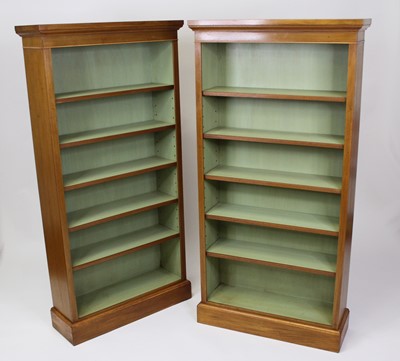 Lot 2538 - A pair of walnut freestanding open bookshelves...